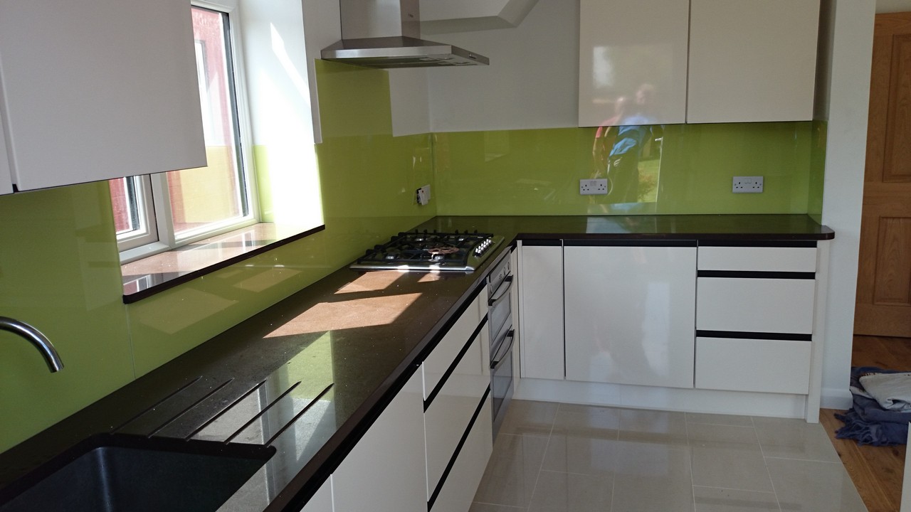 Lime green glass kitchen splashback installed by East Ham glaziers